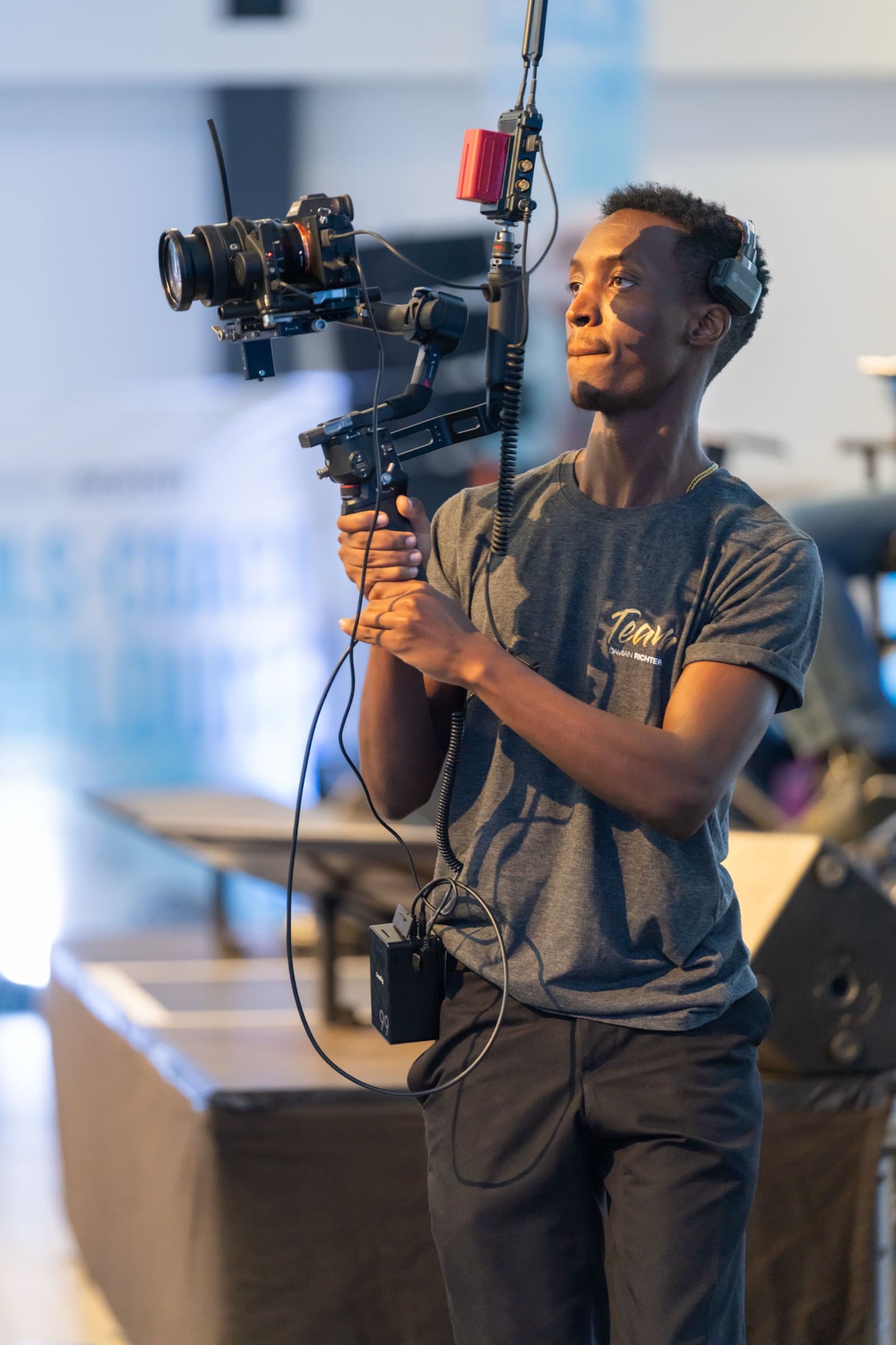 Aminu Hassan Iradukunda (Creative Aminu) covering a Damian Richter event as videographer