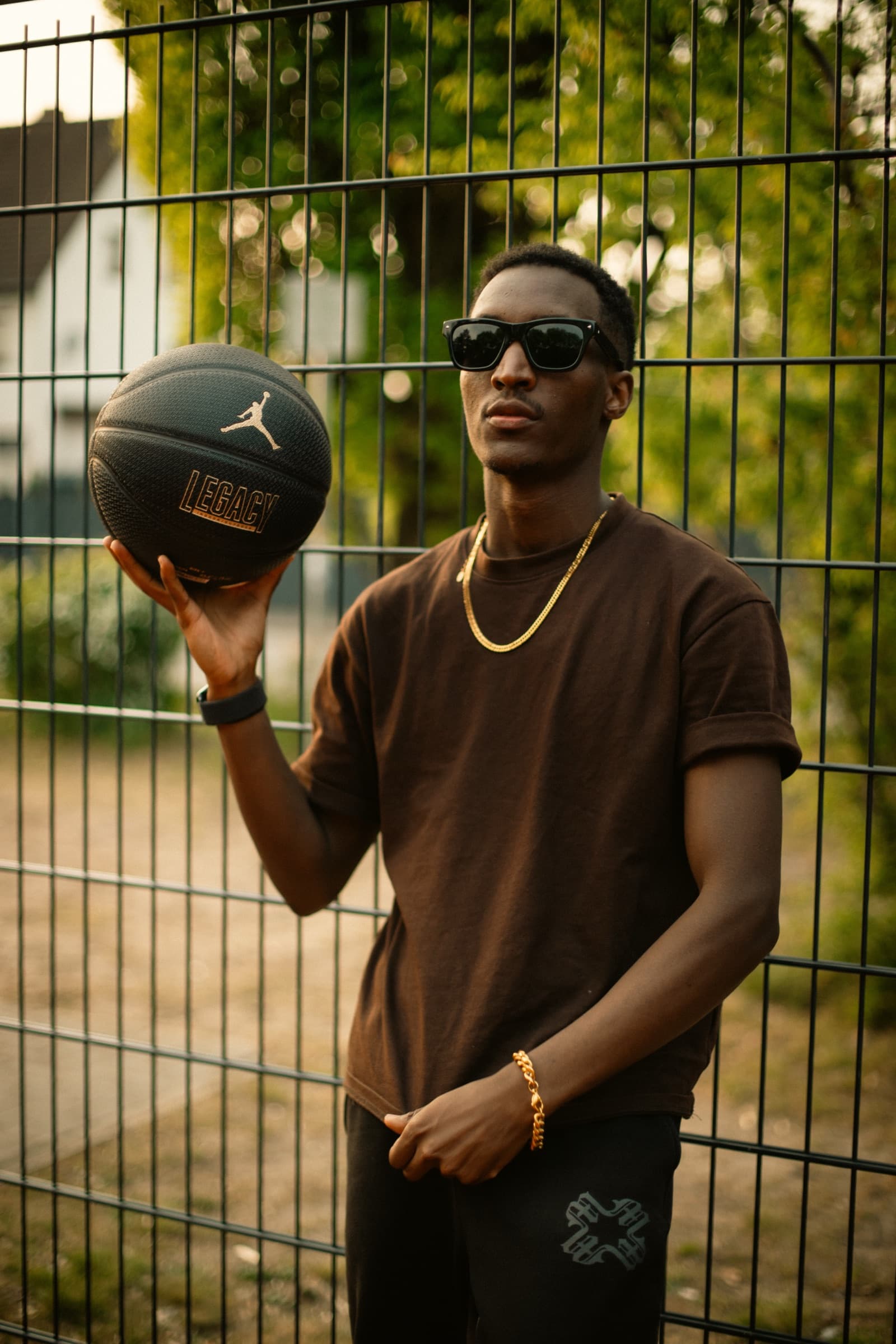 Aminu Hassan Iradukunda (Creative Aminu) holding a basketball